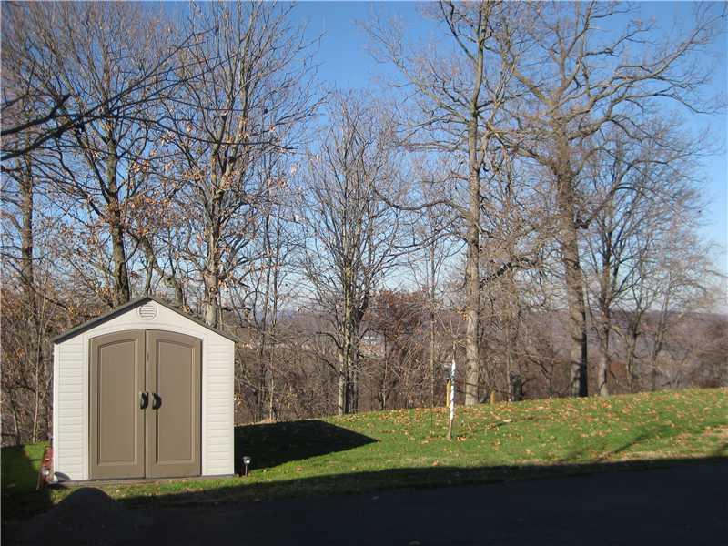 Land/Lot. Enjoy the view from your level USABLE two tiered backyard enhanced by a wooded border.  Note: Storage shed provides great additional storage for lawn equipment, etc.