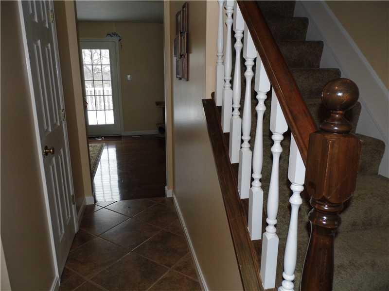 Entry/Foyer. Great view of foyer - note- NEW CERAMIC FLOORING and GLEAMIN HARDWOODS