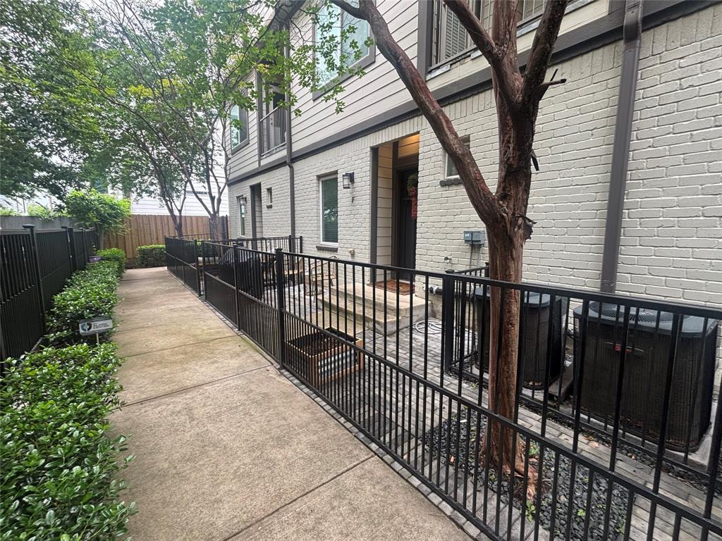 5924 Hudson Street, Unit F Dallas, TX 75206 - Photo 25 of 25 a view of a house with wooden fence