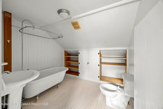 a bathroom with a sink and toilet