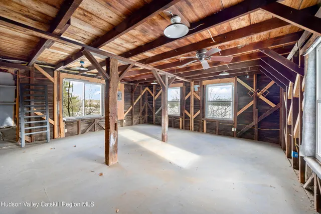 a view of an empty room with stairs