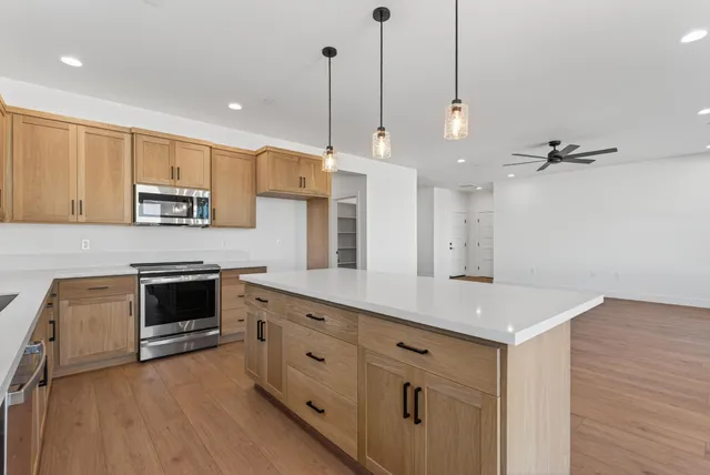 a kitchen with a sink and a window
