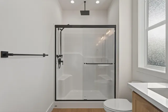 a bathroom with a double vanity sink and mirror