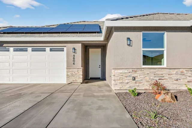 a front view of a house with a garage