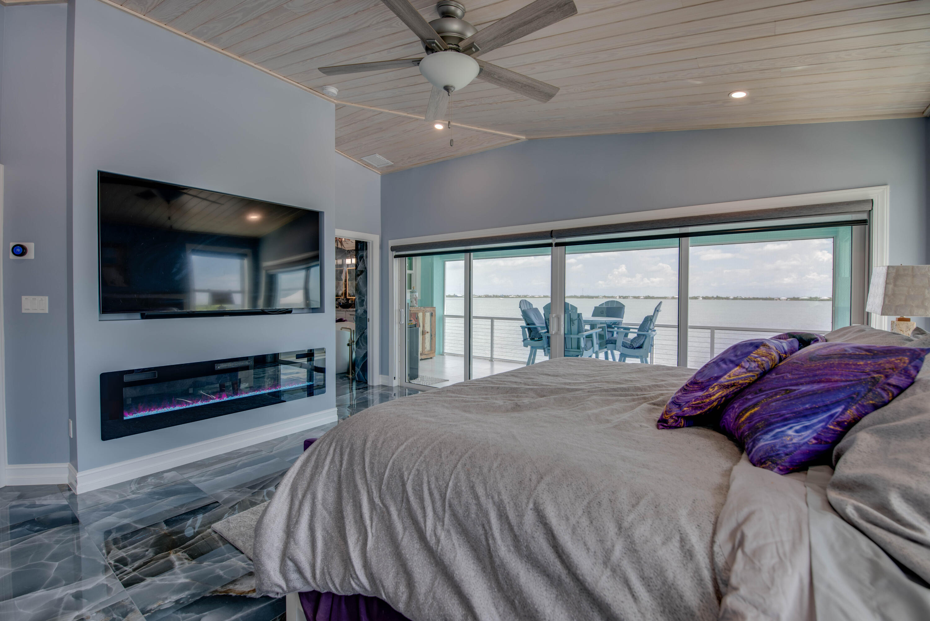 747 La Fitte Road Summerland Key, FL 33042 - Photo 101 of 103 a bedroom with a bed and a flat screen tv