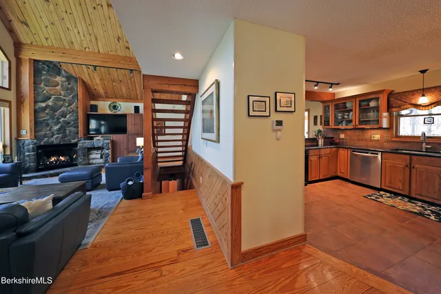 a kitchen with stainless steel appliances granite countertop a refrigerator and a stove