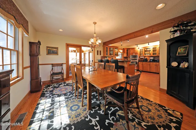 a dining room with a table and chairs