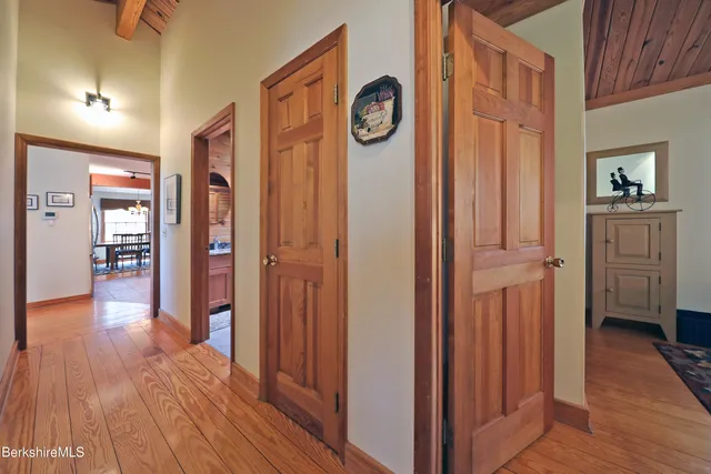 a view of hallway with wooden floor