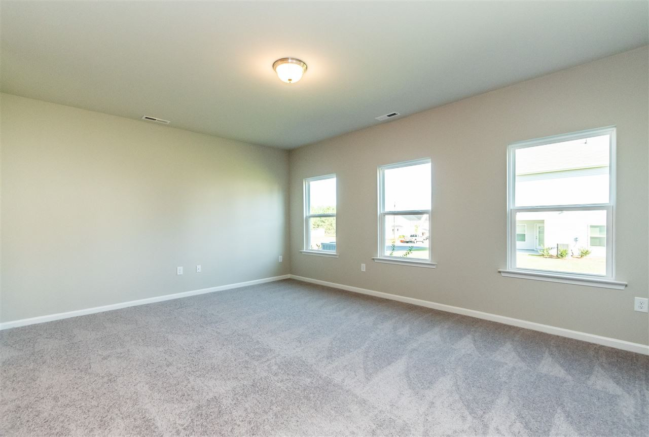 6818 Resting Grove Road, Unit 108 Raleigh, NC 27610 - Photo 14 of 24 A representative photo of a Braselton plan already built for demonstration purposes. New construction is under way. Family Room