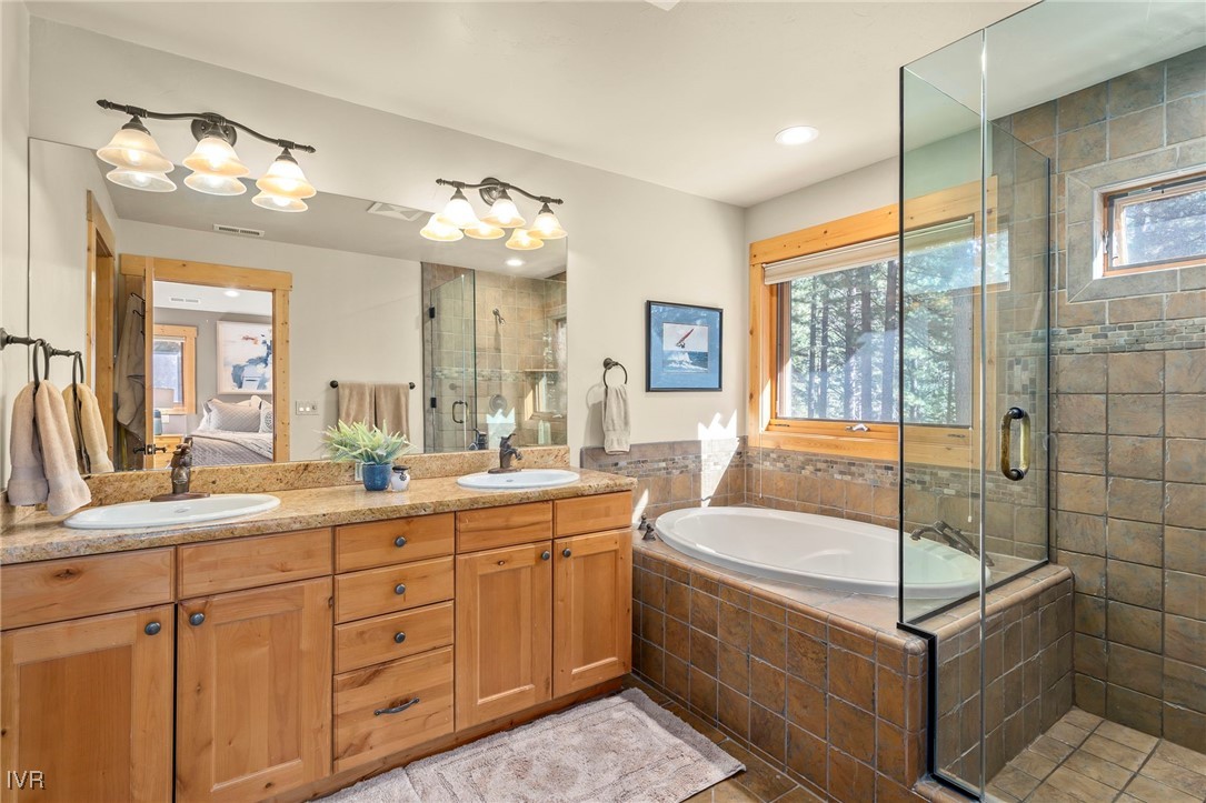 1089 Oxen Road Incline Village, NV 89451 - Photo 20 of 33 a spacious bathroom with a tub sink and mirror