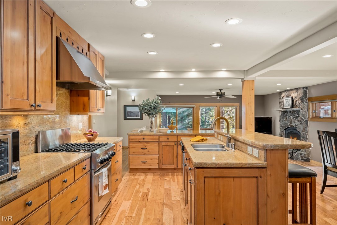 1089 Oxen Road Incline Village, NV 89451 - Photo 10 of 33 a kitchen with stainless steel appliances kitchen island granite countertop a sink and cabinets