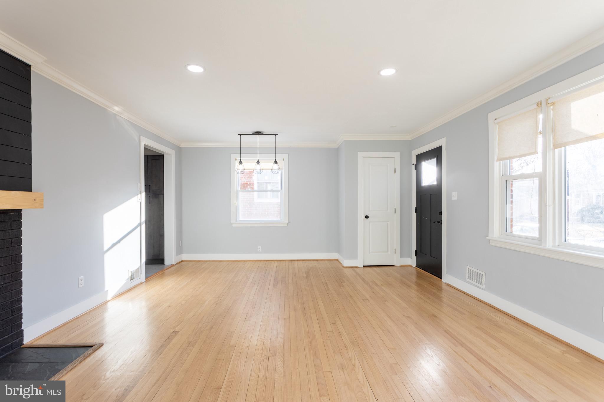 1809 Florin Street Silver Spring, MD 20902 - Photo 11 of 41 a view of an empty room with wooden floor and a window