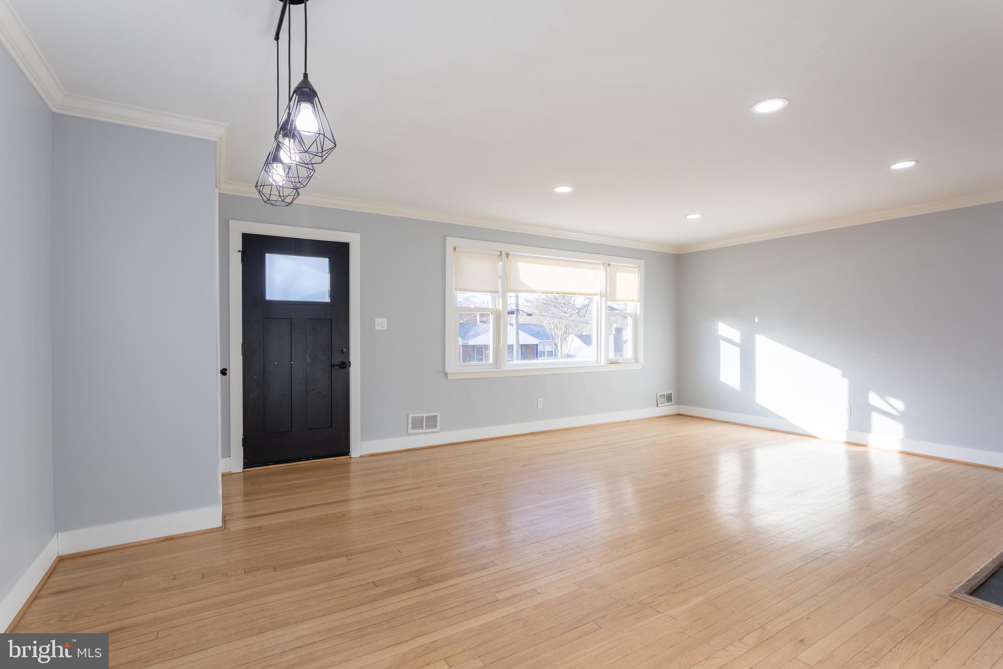 1809 Florin Street Silver Spring, MD 20902 - Photo 12 of 41 a view of an empty room with wooden floor and a window