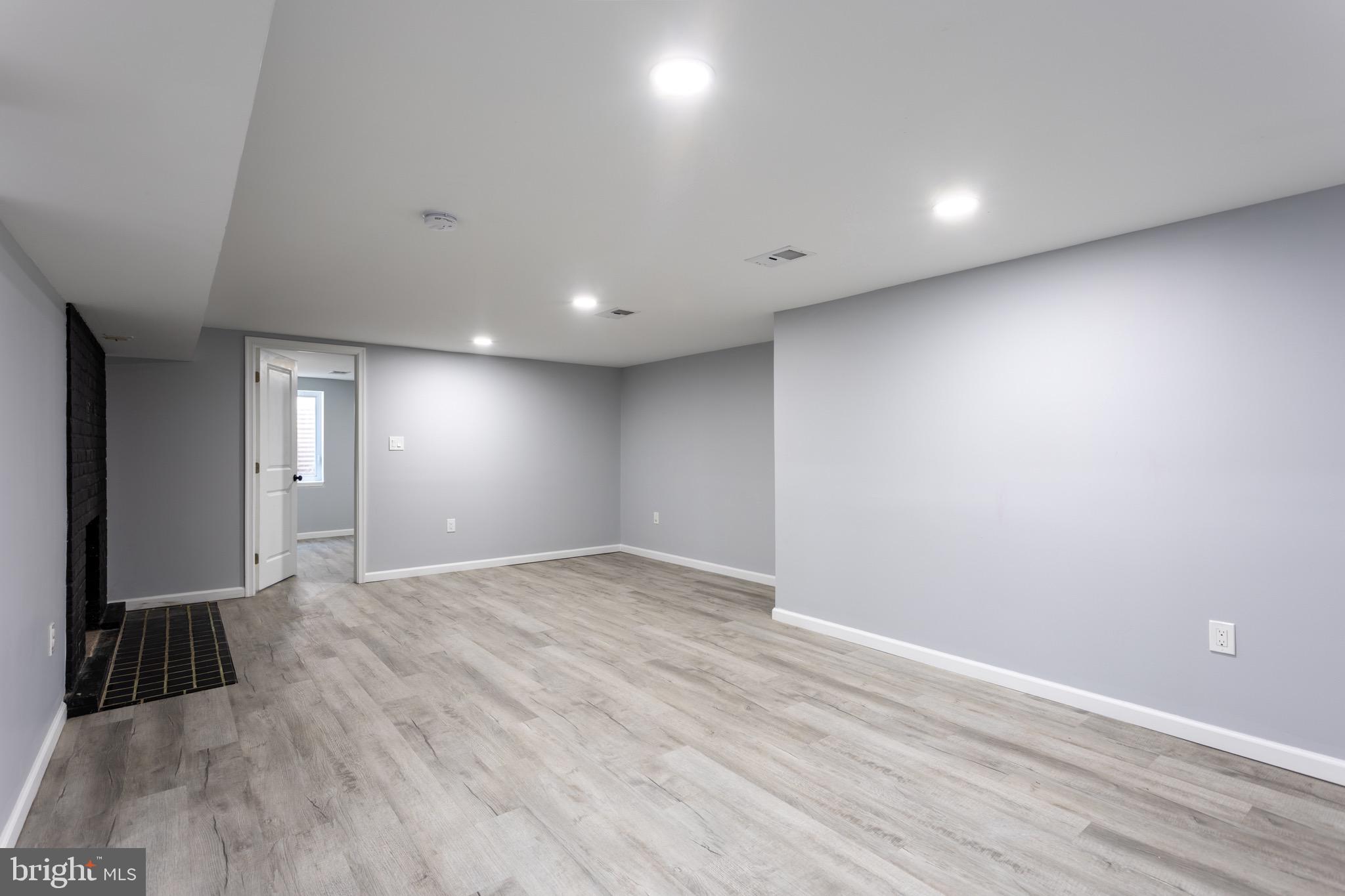 1809 Florin Street Silver Spring, MD 20902 - Photo 30 of 41 an empty room with wooden floor and windows