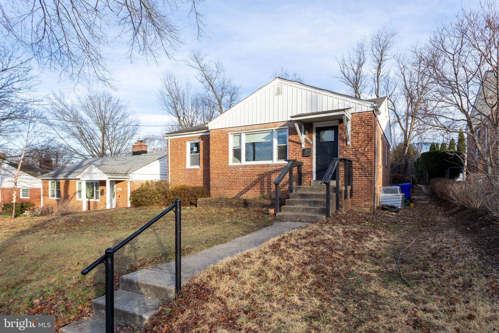 1809 Florin Street Silver Spring, MD 20902 - Photo 3 of 41 a front view of a house with yard and trees