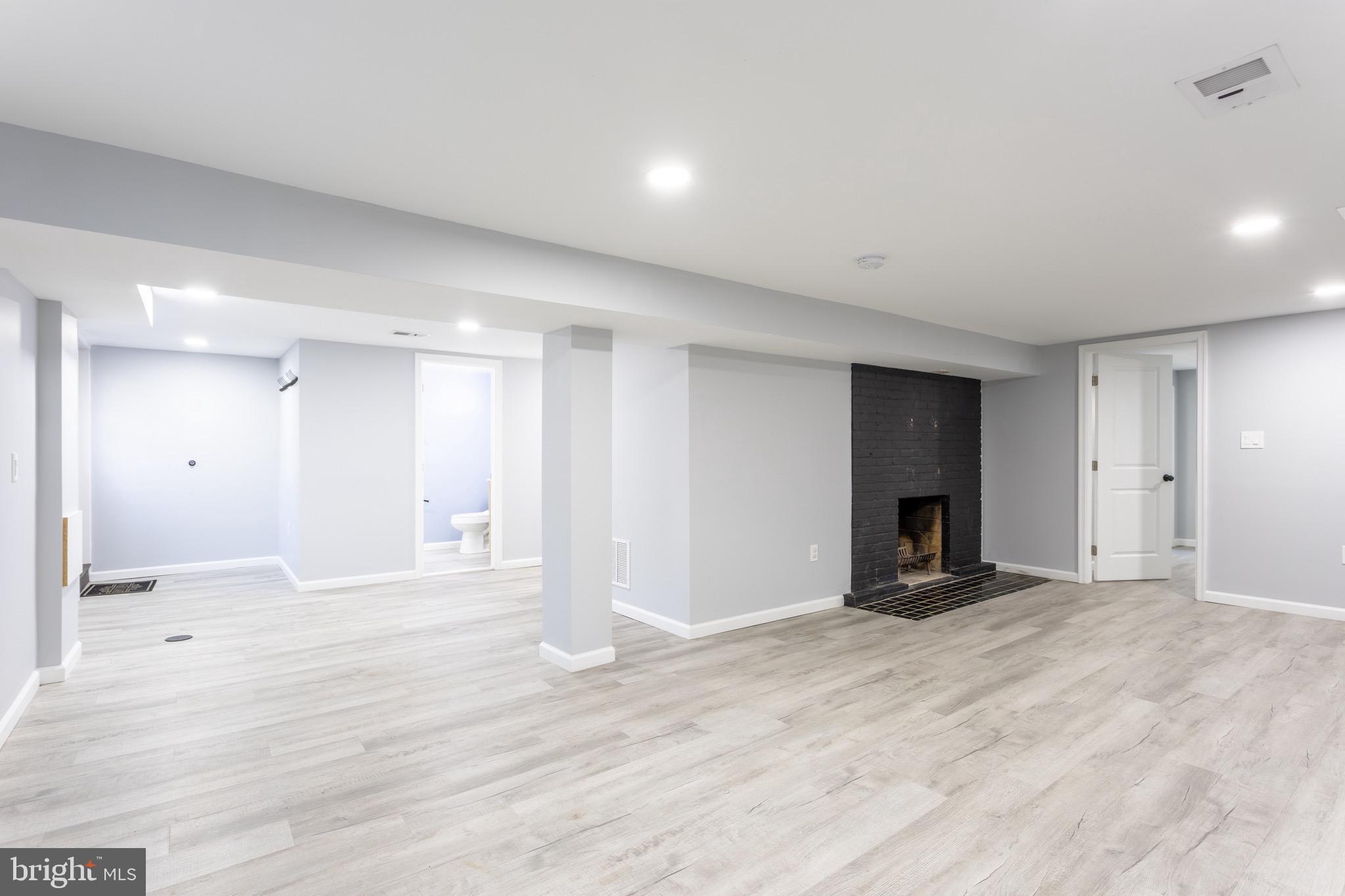 1809 Florin Street Silver Spring, MD 20902 - Photo 31 of 41 a view of an empty room with a fireplace
