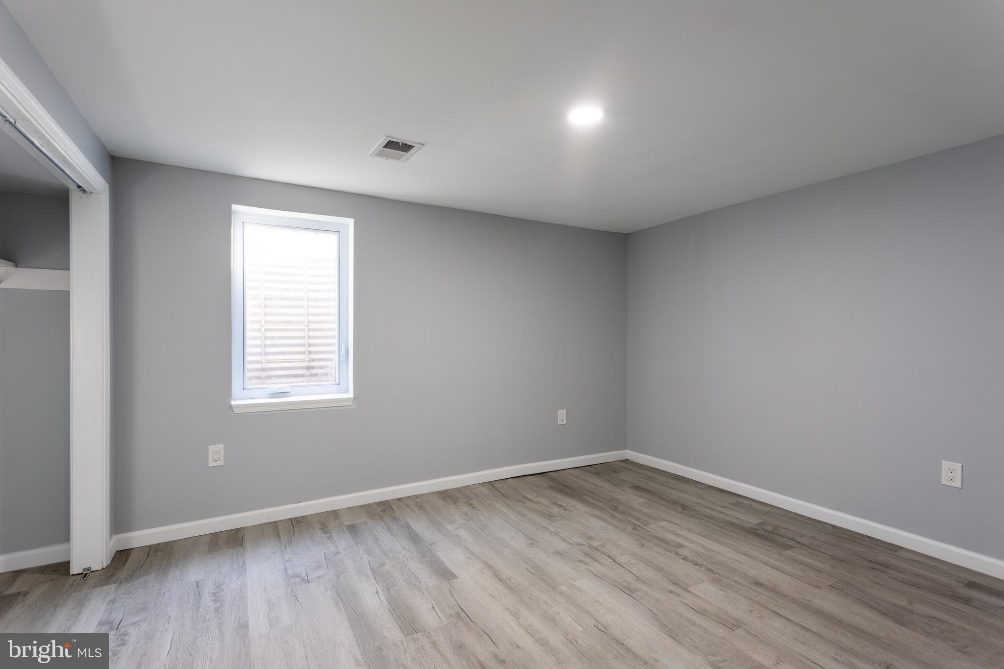 1809 Florin Street Silver Spring, MD 20902 - Photo 35 of 41 an empty room with wooden floor and window