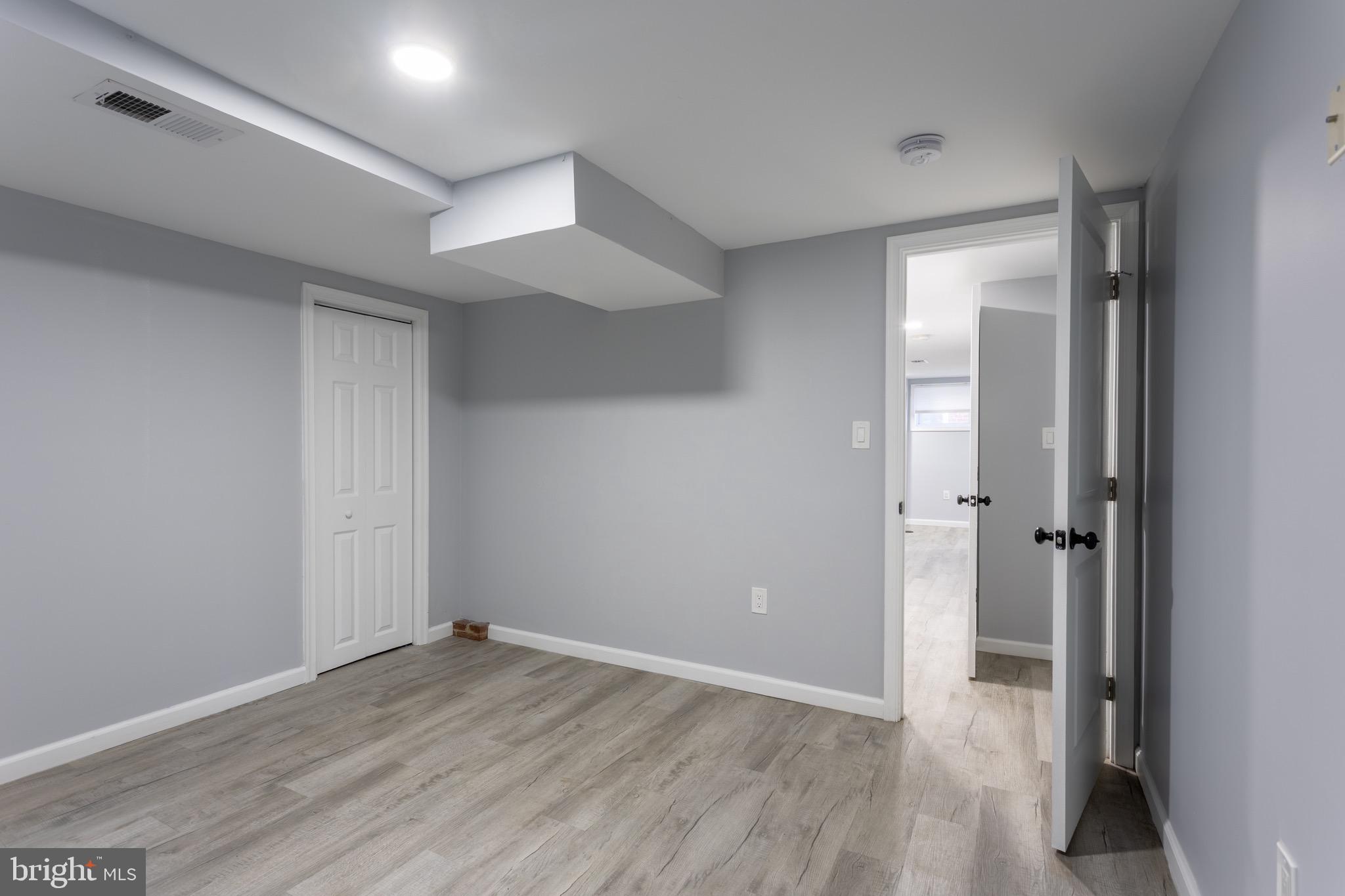1809 Florin Street Silver Spring, MD 20902 - Photo 40 of 41 wooden floor in an empty room