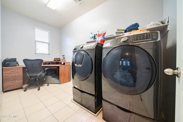a utility room with dryer and washer