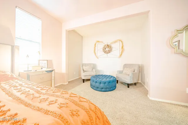 a bedroom with a bed and a cabinets