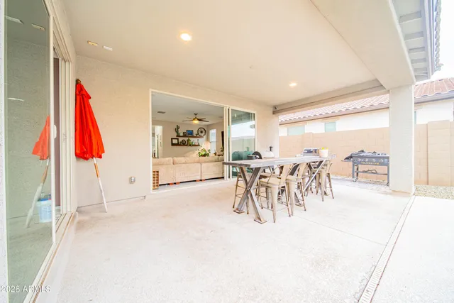 a view of a room with furniture and a table