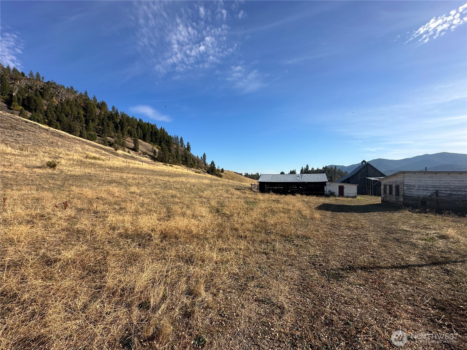 640 Highland Loop Road Kettle Falls, WA 99141 - Photo 23 of 38 a view of a dry yard with wooden fence