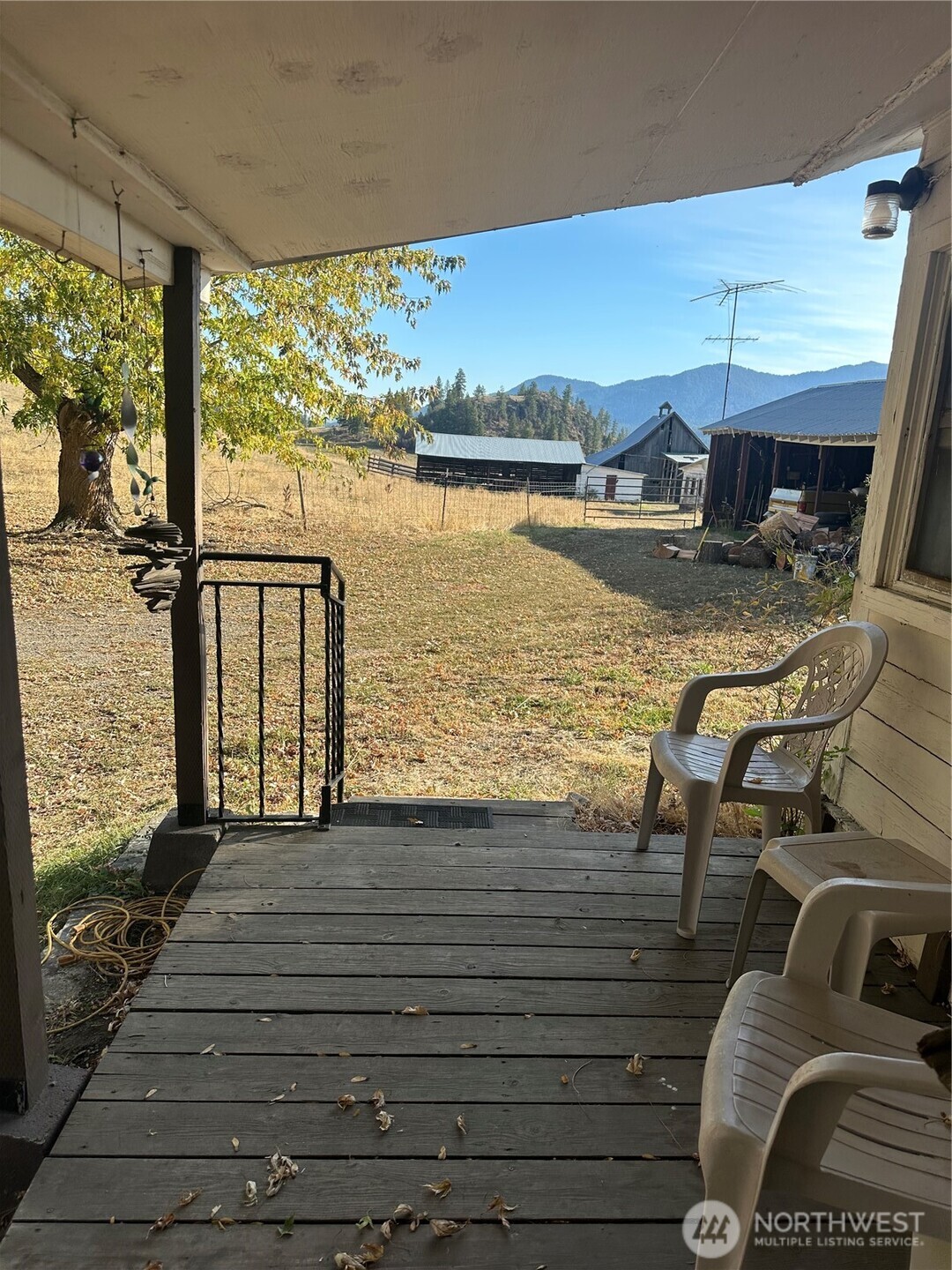 640 Highland Loop Road Kettle Falls, WA 99141 - Photo 34 of 38 a view of a balcony with chair and wooden floor