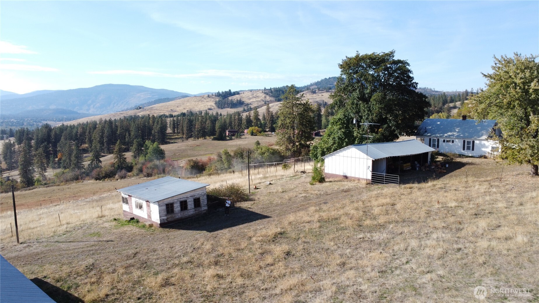 640 Highland Loop Road Kettle Falls, WA 99141 - Photo 37 of 38 a view of a house with a yard and sitting area