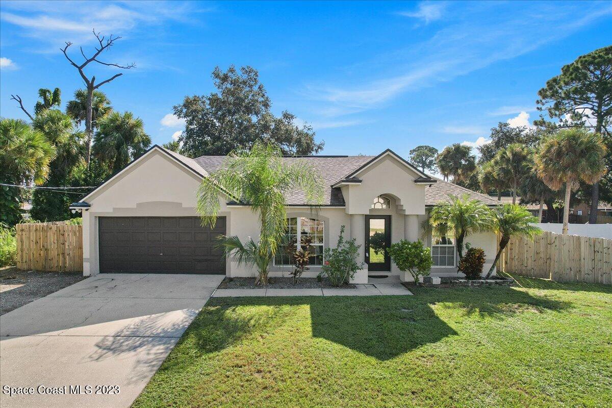 6949 Boston Road Cocoa, FL 32927 - Photo 2 of 33 a front view of a house with garden