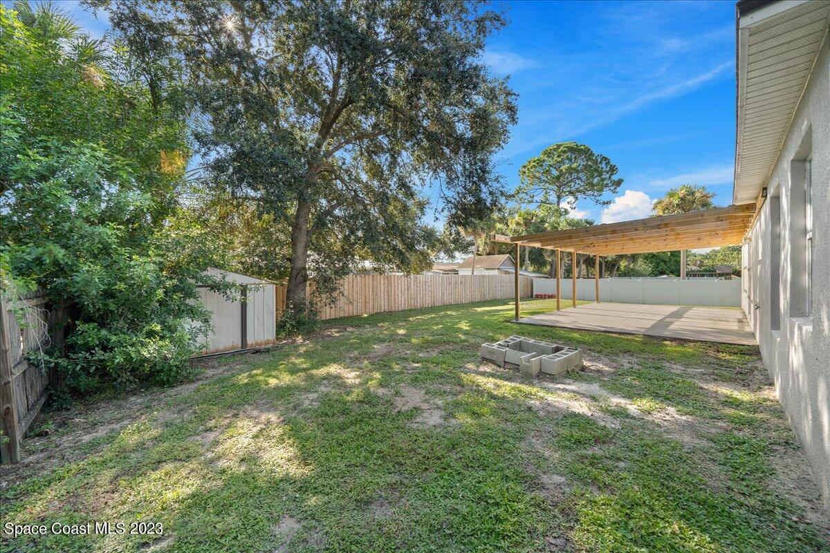 6949 Boston Road Cocoa, FL 32927 - Photo 21 of 33 a view of backyard with green space