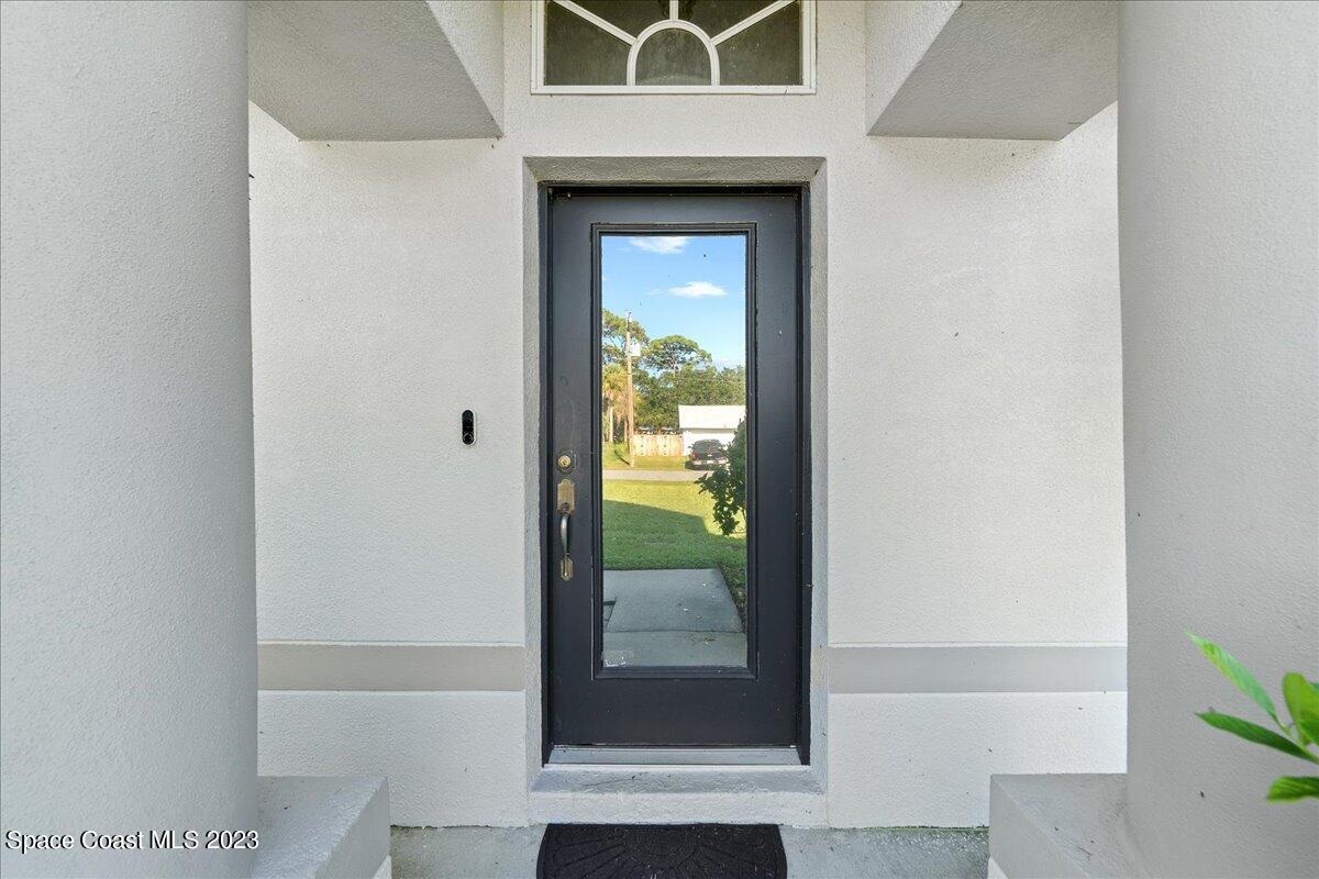 6949 Boston Road Cocoa, FL 32927 - Photo 3 of 33 a view of front door