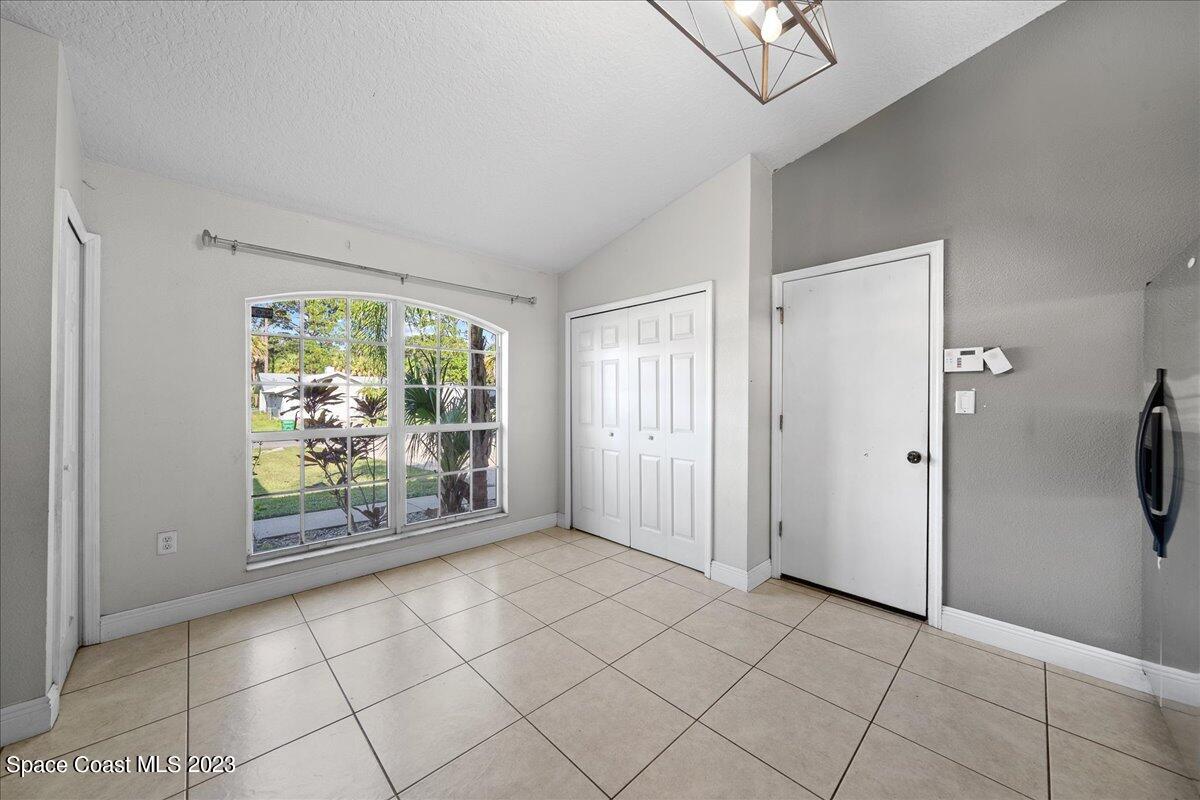 6949 Boston Road Cocoa, FL 32927 - Photo 8 of 33 a view of an empty room with a window