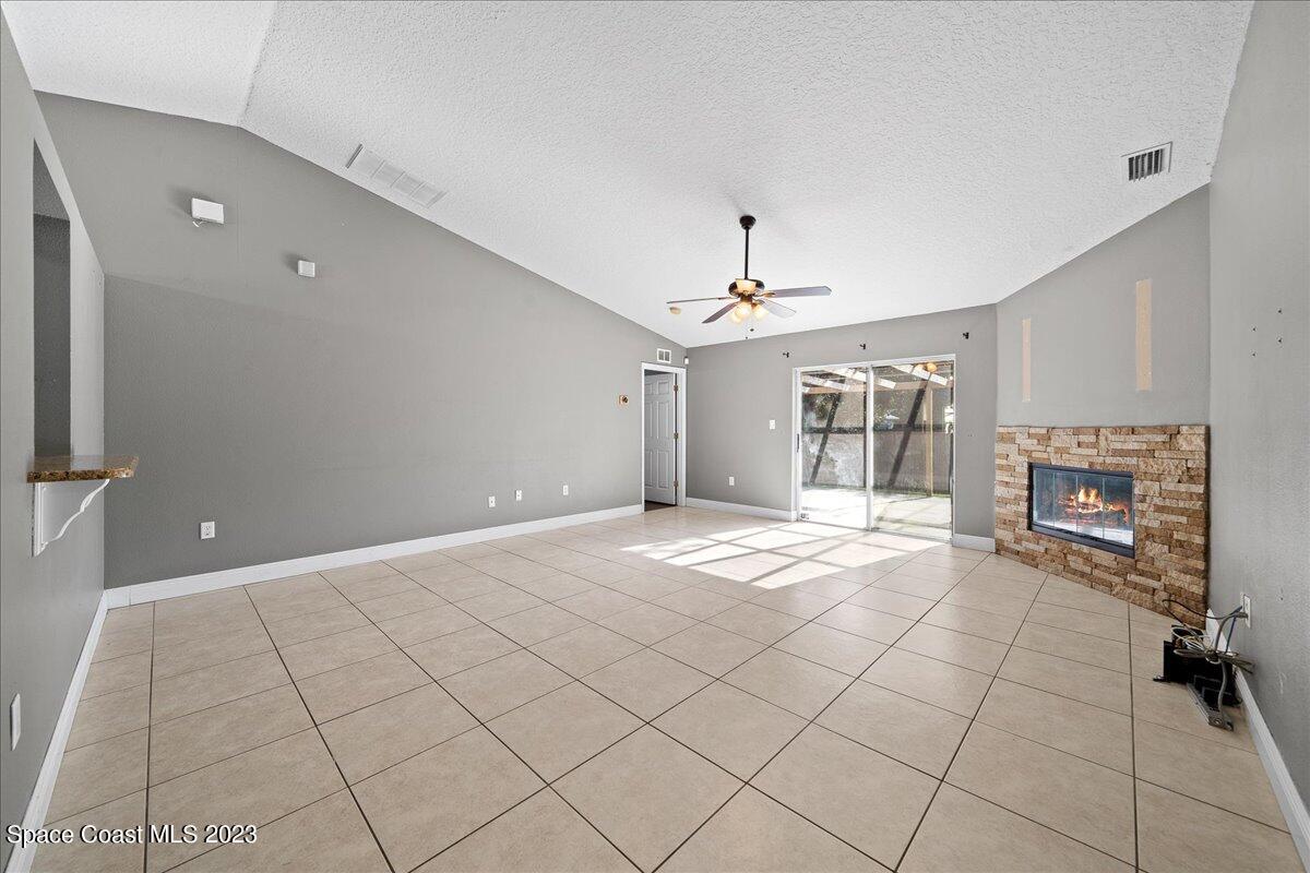 6949 Boston Road Cocoa, FL 32927 - Photo 10 of 33 a view of a livingroom with a fireplace
