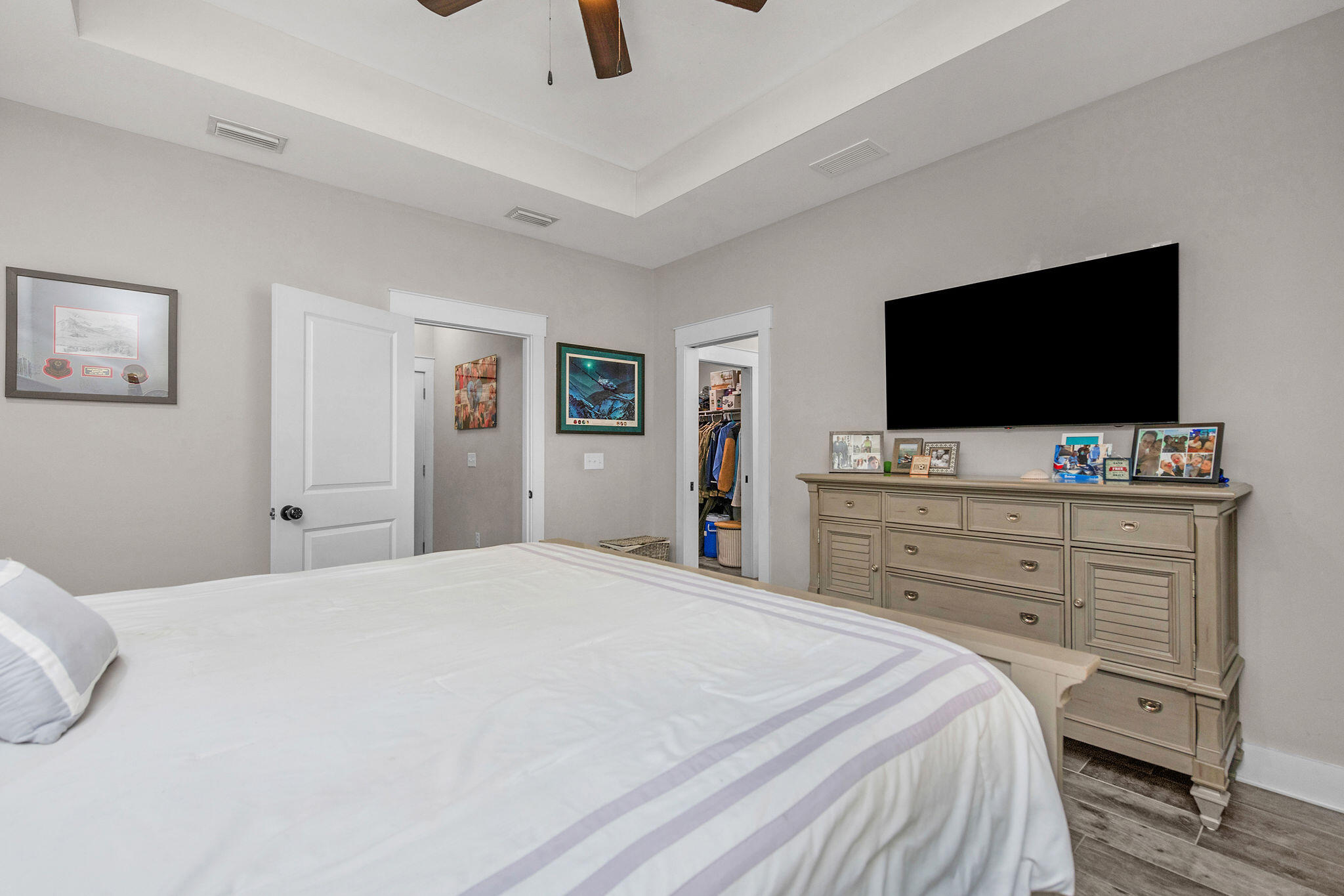 8914 Timber Lane Navarre, FL 32566 - Photo 20 of 40 a bedroom with a bed and a flat screen tv in it