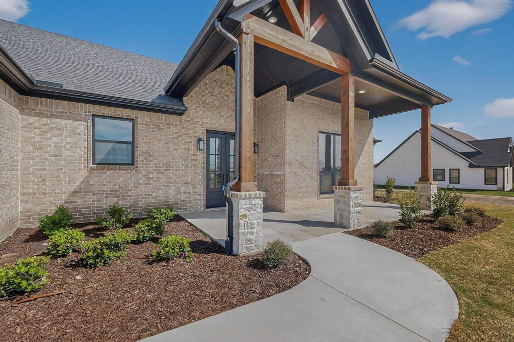 4961 County Road 1098 Celeste, TX 75423 - Photo 8 of 40 Property entrance featuring brick siding and covered porch