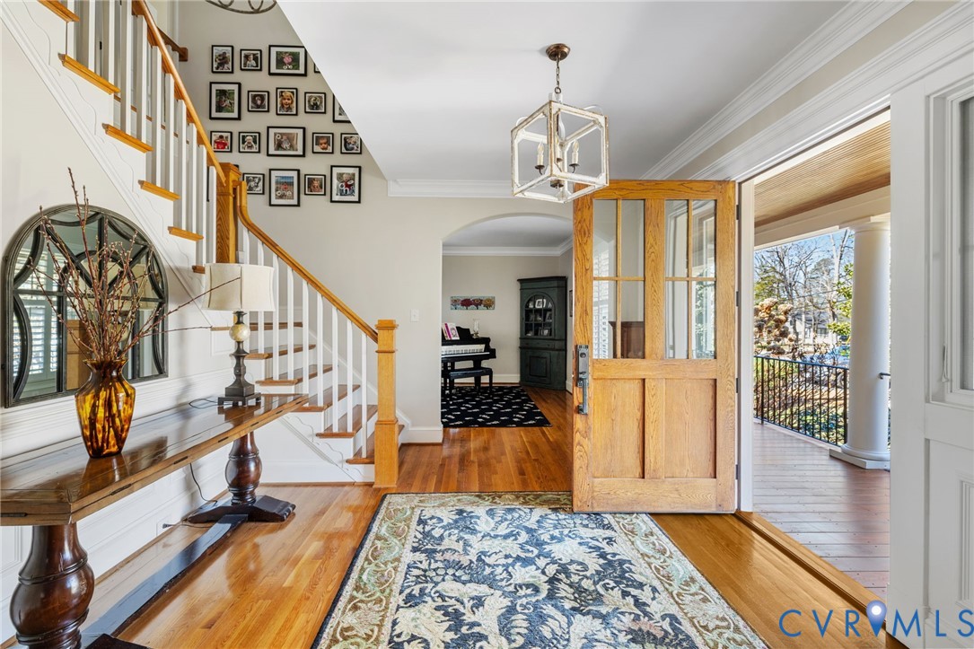8947 Cherokee Road Richmond, VA 23235 - Photo 5 of 45 a view of a hallway with wooden floor and staircase