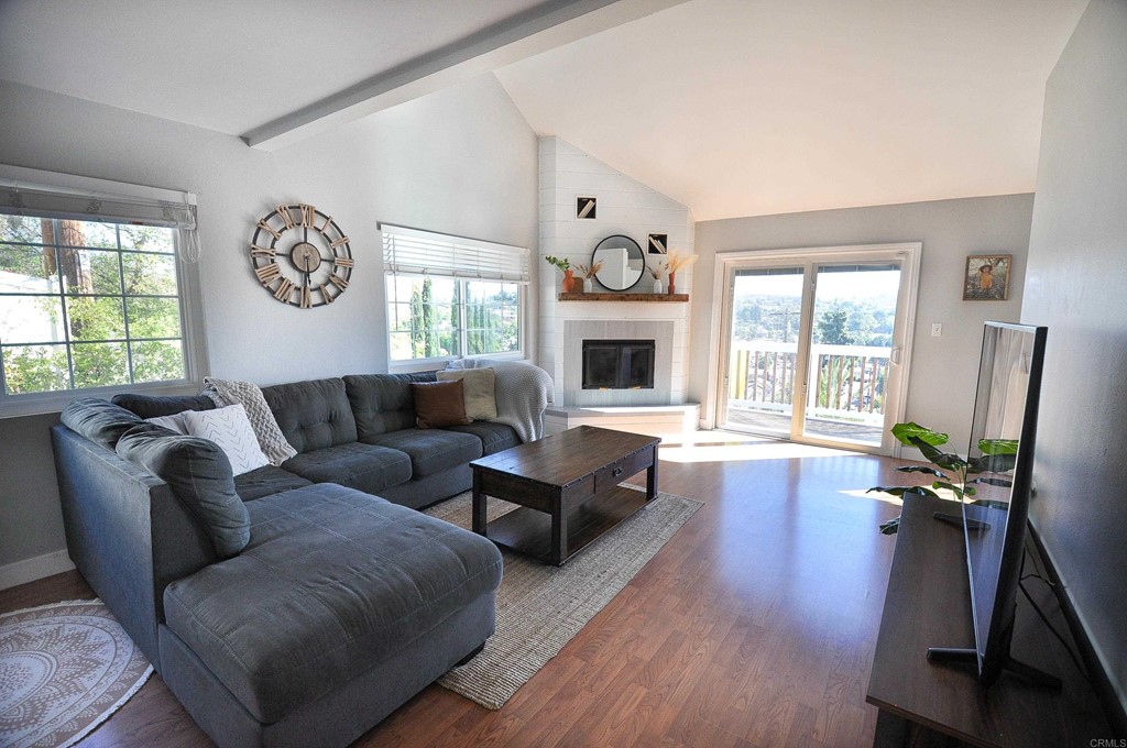 8164 Sunset Road Lakeside, CA 92040 - Photo 1 of 1 a living room with furniture and a fireplace