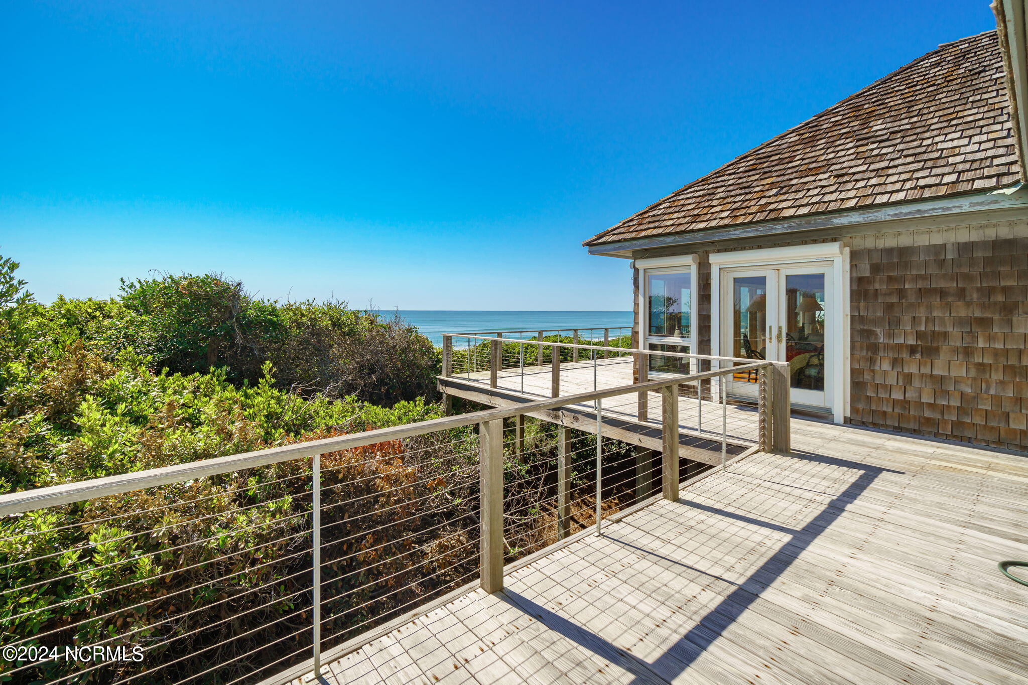209 Salter Path Road Pine Knoll Shores, NC 28512 - Photo 21 of 73 Deck access from kitchen