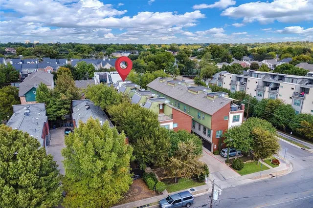 an aerial view of a house with a garden