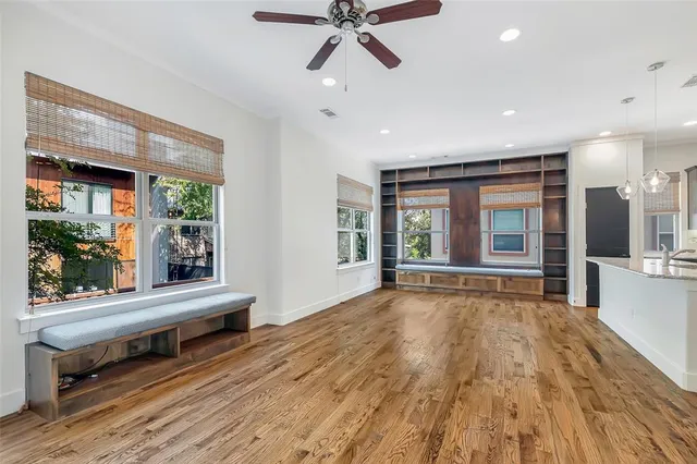 a view of an entryway with wooden floor and door