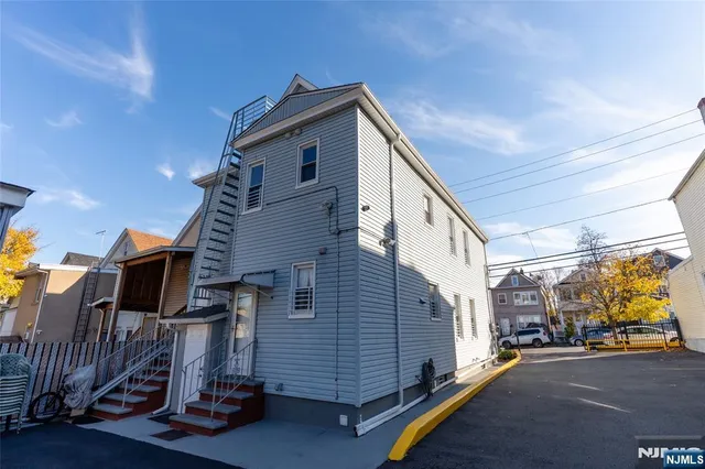 a view of a house with a street