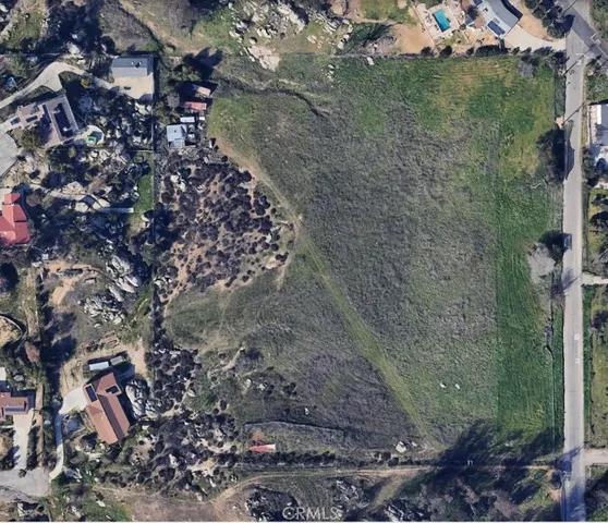 a aerial view of a house with a yard