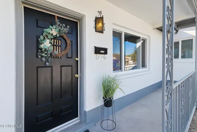 a vase of flowers sitting on a floor