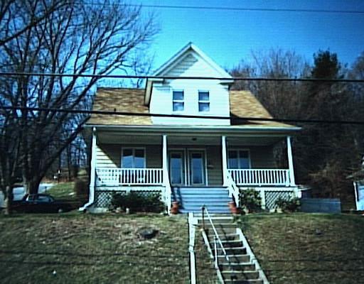 82 Maple Street Seymour, CT 06483 - Photo 1 of 1 a front view of a house with a garden