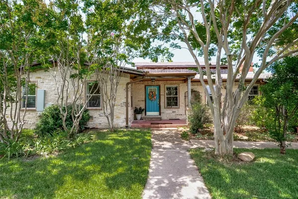 a view of a house with a garden