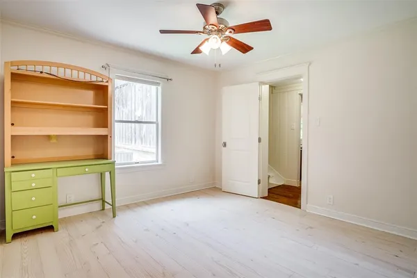 a view of workspace with window and a ceiling fan