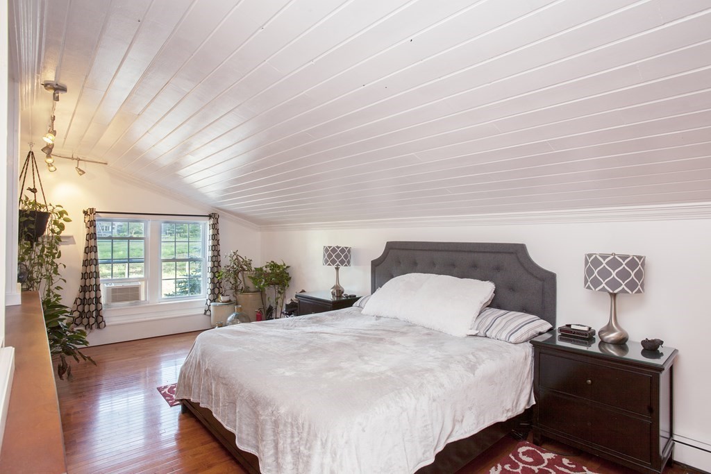 295 Stumpfield Road Hopkinton, NH 03229 - Photo 14 of 36 a bedroom with a bed and window