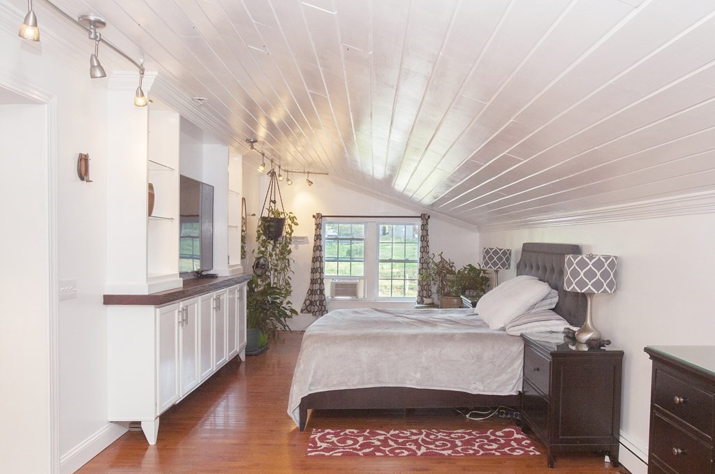 295 Stumpfield Road Hopkinton, NH 03229 - Photo 15 of 36 a bed room with a bed and a window