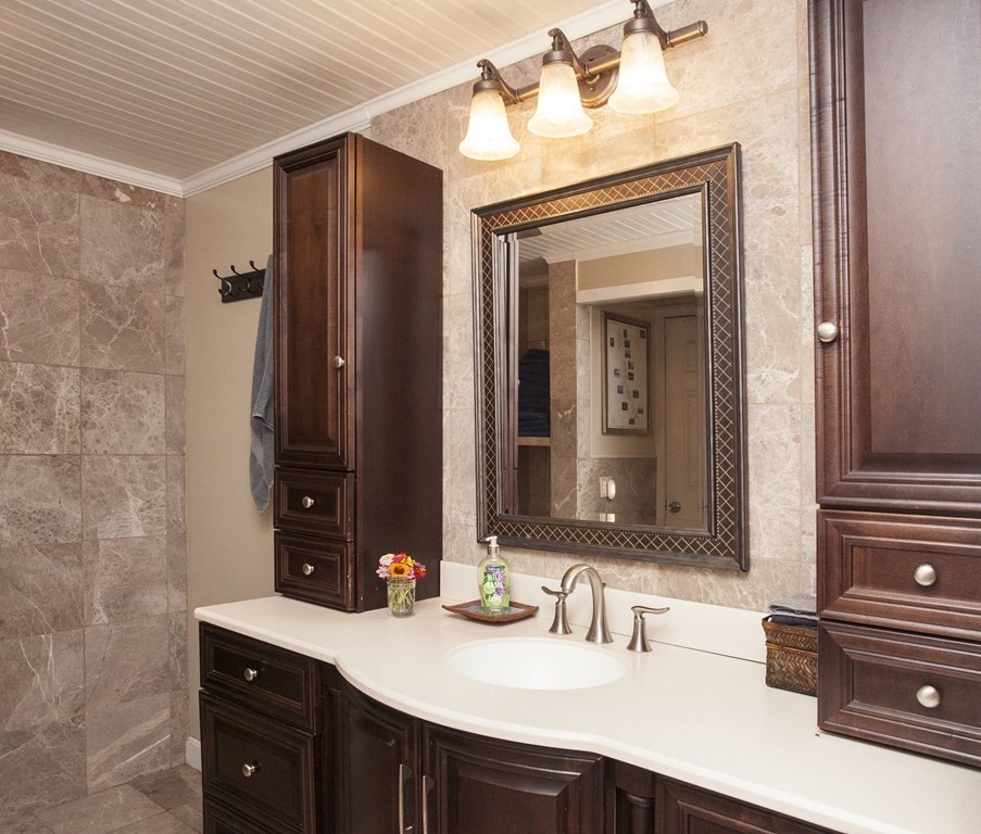 295 Stumpfield Road Hopkinton, NH 03229 - Photo 17 of 36 a bathroom with a sink and a mirror