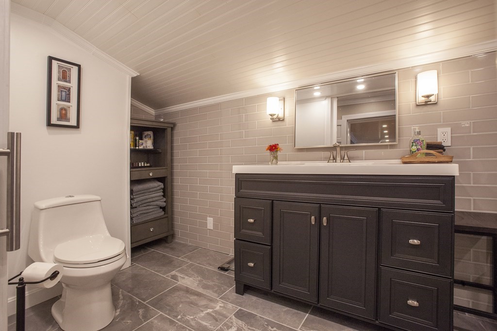 295 Stumpfield Road Hopkinton, NH 03229 - Photo 22 of 36 a bathroom with a sink a toilet and a mirror